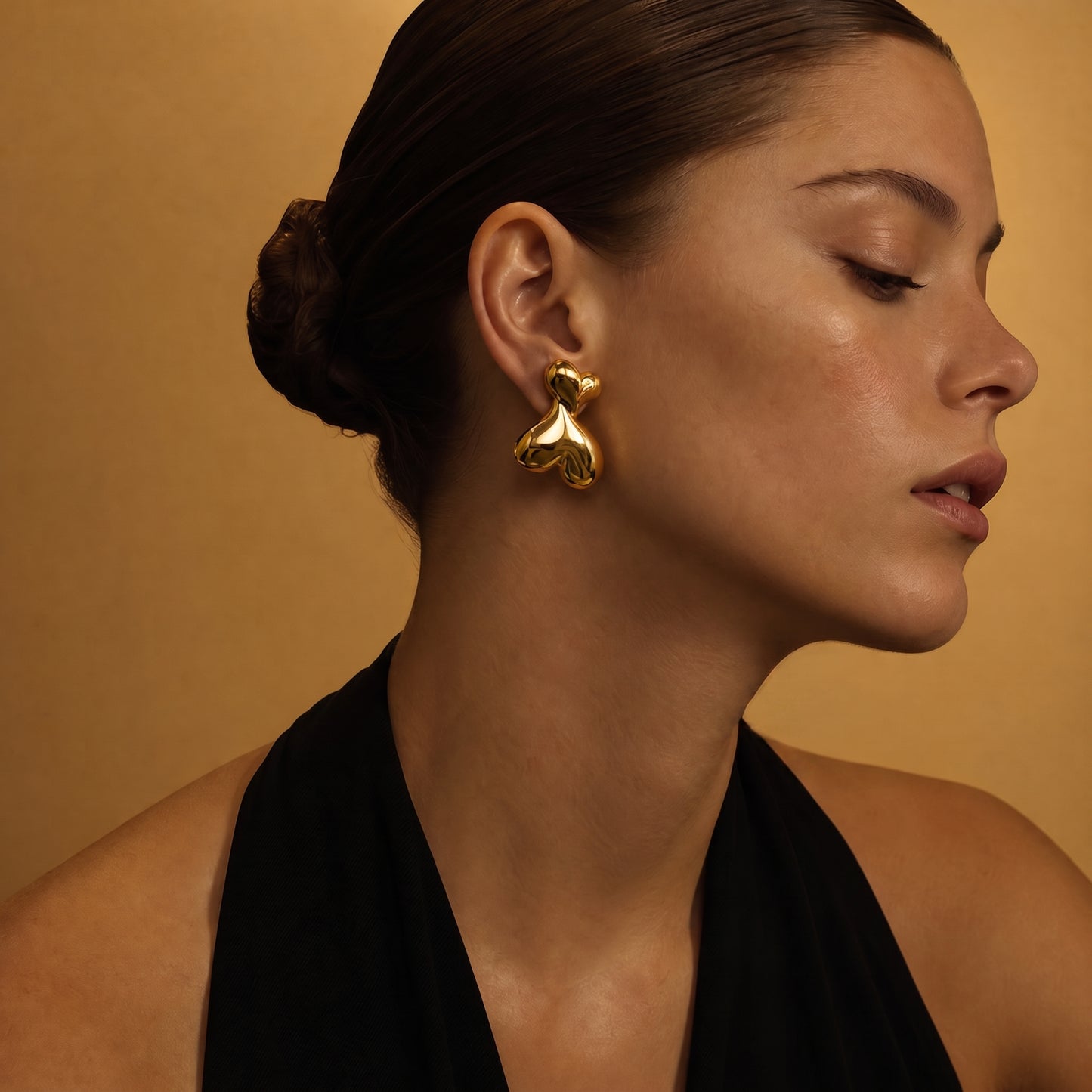Puffy Heart Earrings on model